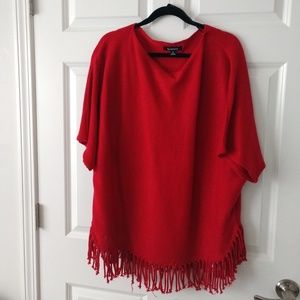 A red poncho sweater